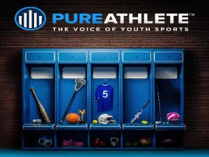 A row of blue sports lockers against a brick wall, each displaying various sports equipment, including a baseball bat, lacrosse stick, basketball, soccer ball, tennis racket, and a volleyball, with a blue jersey featuring the number 5. The logo "PURE ATHLETE: THE VOICE OF YOUTH SPORTS" is prominently displayed at the top.