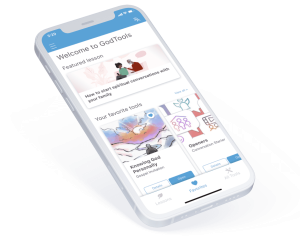 Tilted smartphone screen displaying the GodTools app with options like "Featured lesson" and "Your favorite tools."